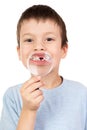 Boy show lost tooth through magnifying glass