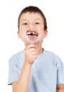 Boy show lost tooth through magnifying glass