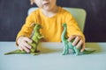 Boy showing a dinosaur as a paleontologist Royalty Free Stock Photo