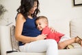 Boy Showing Love Towards Unborn Baby In Mother`s Tummy