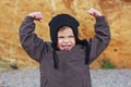 Boy shows power and strenth Royalty Free Stock Photo