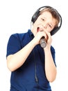 Boy singing into a microphone. Very emotional. Royalty Free Stock Photo