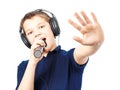Boy singing into a microphone. Very emotional. Royalty Free Stock Photo