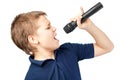 Boy singing into a microphone. Very emotional. Royalty Free Stock Photo