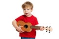 Cute Boy Playing Ukulele Guitar Royalty Free Stock Photo