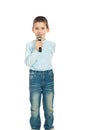 Boy singing to microphone Royalty Free Stock Photo