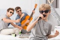 Boy singing to microphone Royalty Free Stock Photo