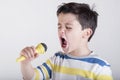 Boy singing to microphone