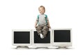 Boy sit on CRT monitor Royalty Free Stock Photo