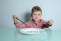 Diet for a little boy who is hungry on the kitchen