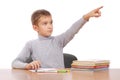 Boy sits at a table. Royalty Free Stock Photo