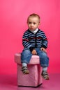 Boy sitting on the ottoman