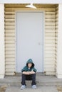Boy Sitting on a Curb Royalty Free Stock Photo