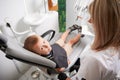 Cute child sitting in dental chair in dental office. Royalty Free Stock Photo