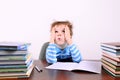 Boy sitting at a desk and looking up Royalty Free Stock Photo