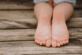 Boy sitting on dock on a wooden pier on a lake shore Royalty Free Stock Photo