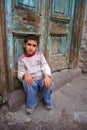 A boy sitting at doorstep Royalty Free Stock Photo