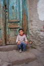 a boy sitting at the doorstep Royalty Free Stock Photo