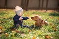 Boy sitting on the grass with a dog Royalty Free Stock Photo