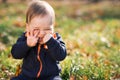 Boy sitting on the grass and hamming Royalty Free Stock Photo