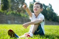 Boy sitting grass Royalty Free Stock Photo