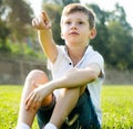 Boy sitting grass Royalty Free Stock Photo