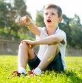 Boy sitting grass Royalty Free Stock Photo