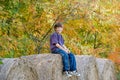 Boy Sitting on Hay Bales Royalty Free Stock Photo