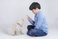 Boy sitting with his dog Royalty Free Stock Photo