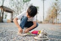 boy sitting in a park with shoelaces Royalty Free Stock Photo