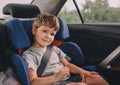 Boy sitting in safety car seat Royalty Free Stock Photo