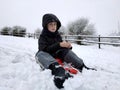 boy sitting on a sled, no gloves Royalty Free Stock Photo