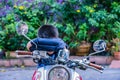 The boy sitting and sleeping on the motorcycle