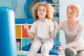 Boy sitting on a swing during therapy Royalty Free Stock Photo