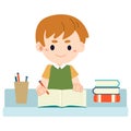 Boy sitting at the table and doing homework Royalty Free Stock Photo