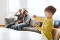 Boy sitting at the table holding spinning top Royalty Free Stock Photo