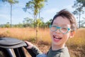 Boy sitting on truck and smiles Royalty Free Stock Photo