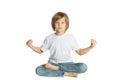 Boy sitting. Yoga. Lotus Position. Royalty Free Stock Photo