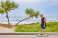 Boy skateboarding along the Main Beach esplanade at Surfers Paradise on the Gold Coast in Queensland, Australia Royalty Free Stock Photo