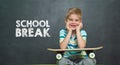 Boy with skateboard and school board with text SCHOOL BREAK