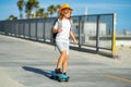 Boy on skateboard skating. Kid skateboarder ride a skateboard on street. Child in a summer city. Little child, toddler