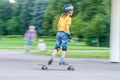 Boy skateboarding on natural background Royalty Free Stock Photo