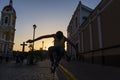 Boy skateboarding in a street of the colonial city of Granada in Nicaragua at sunset Royalty Free Stock Photo