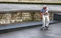 boy skateboarding on street training site