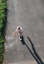 Boy skates on skateboard on asphalt road Royalty Free Stock Photo