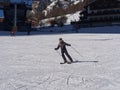 Boy Skier With protective Helmet and Ski Mask having Fun on a Snowy Ski Slope in the Italian Dolomites Mountains Royalty Free Stock Photo