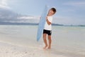Boy with skim board on sea background Royalty Free Stock Photo