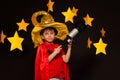 Boy in sky watcher costume with telescope