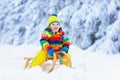 Boy on sled ride. Child sledding. Kid on sledge Royalty Free Stock Photo