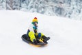 Boy on sled ride. Child sledding. Kid on sledge Royalty Free Stock Photo